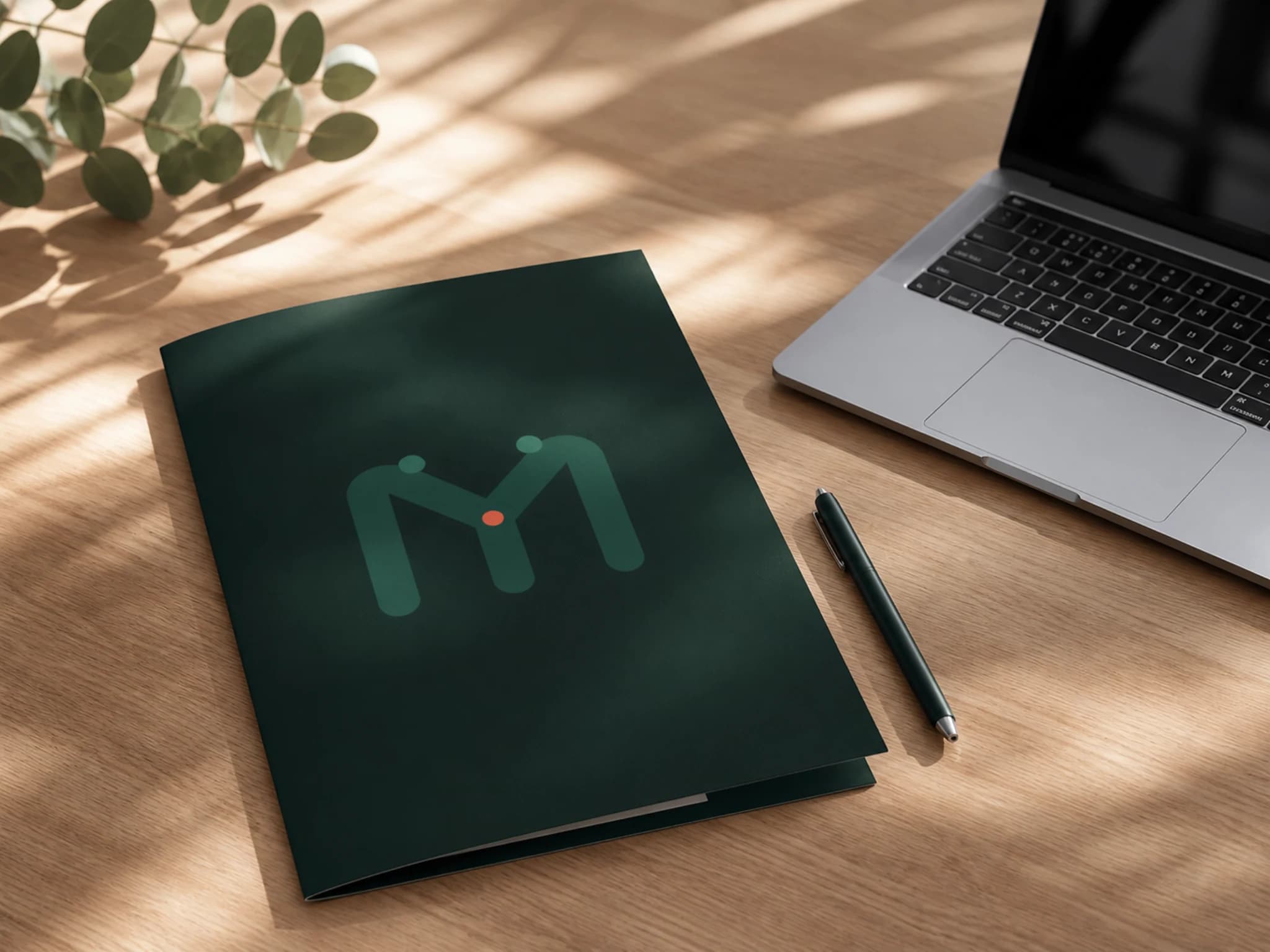 A privacy document folder, laptop and pen arranged on a clear desk