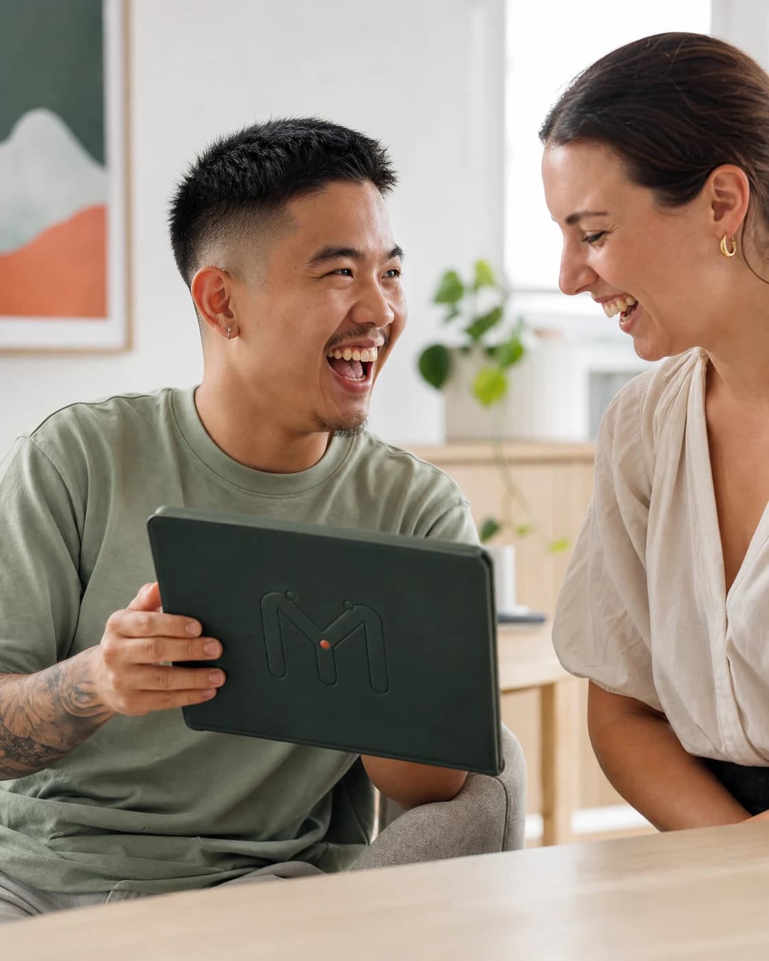 A young adult using a communication app on a tablet during a therapy session